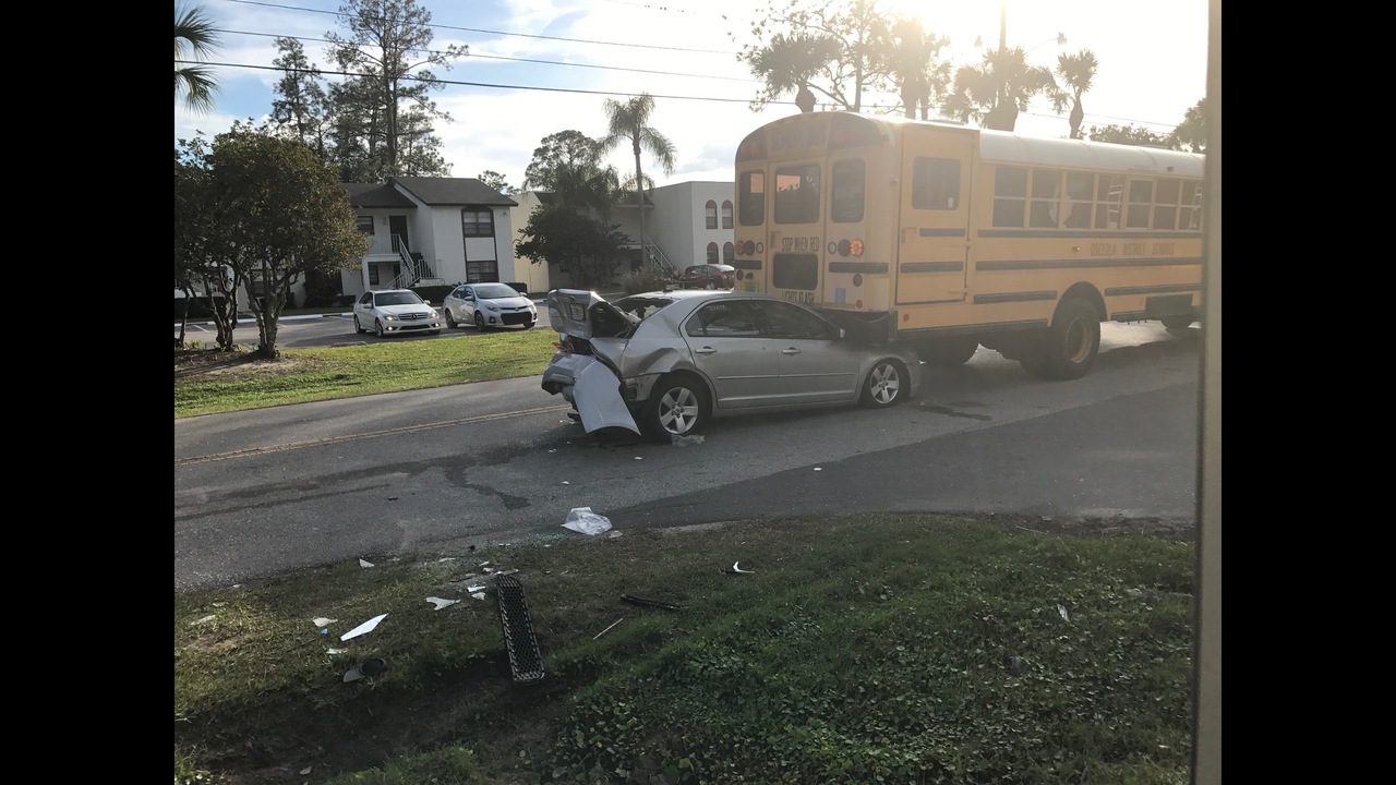 3 people injured when car hits bus in Kissimmee