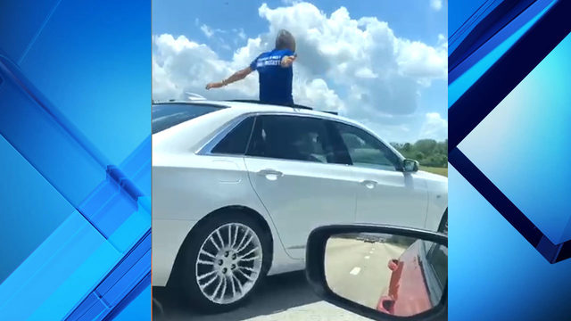 Florida man caught on camera standing in sunroof while driving on Interstate 4
