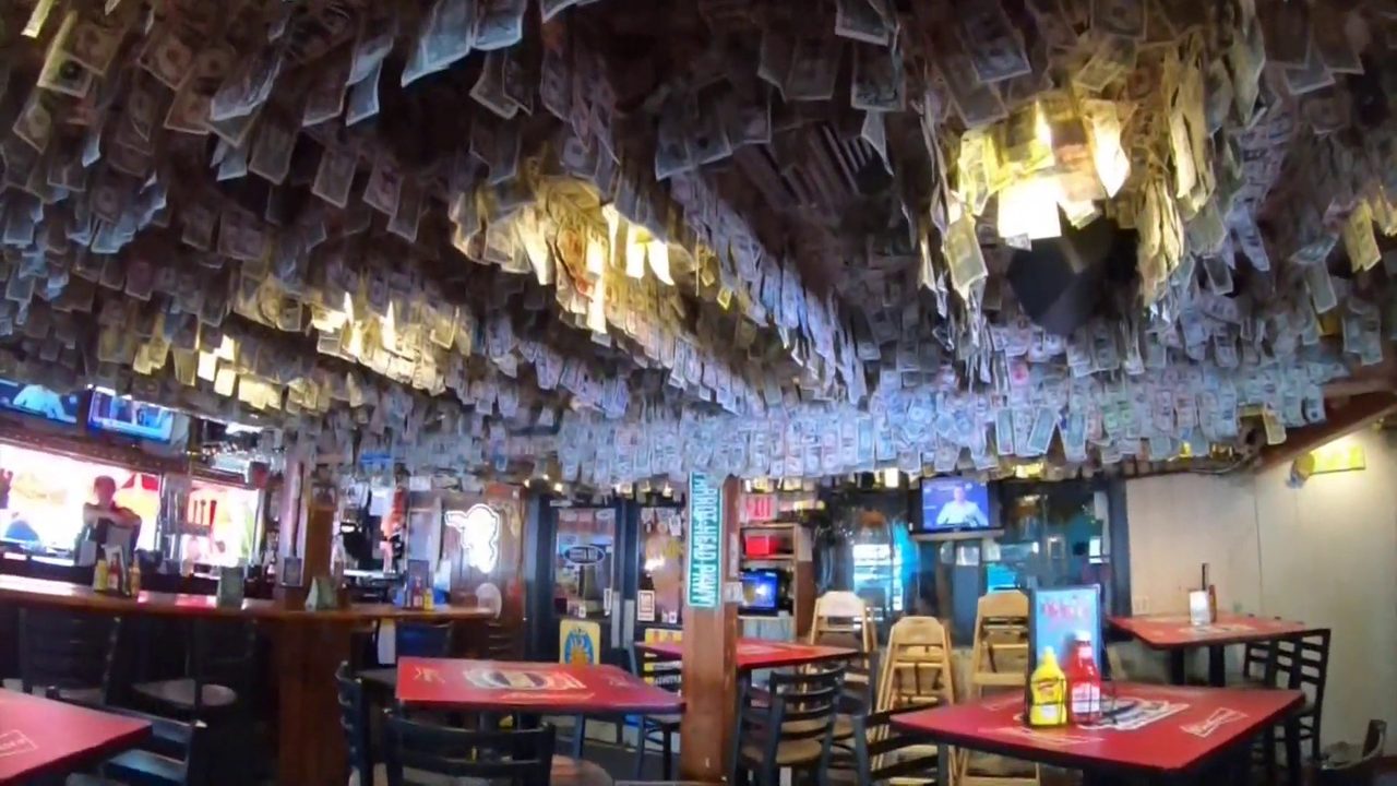 15,000 in dollar bills pulled from Florida bar's walls...